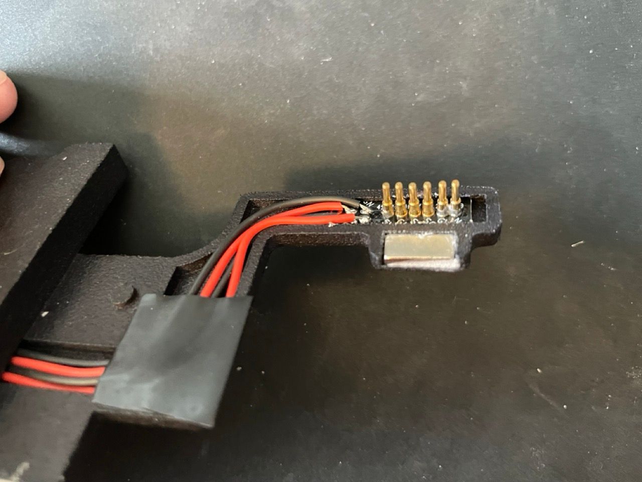 Two of these pins are shorted. It didn't matter for functionality, but the point is, soldering it was hard. Pogo pins concept