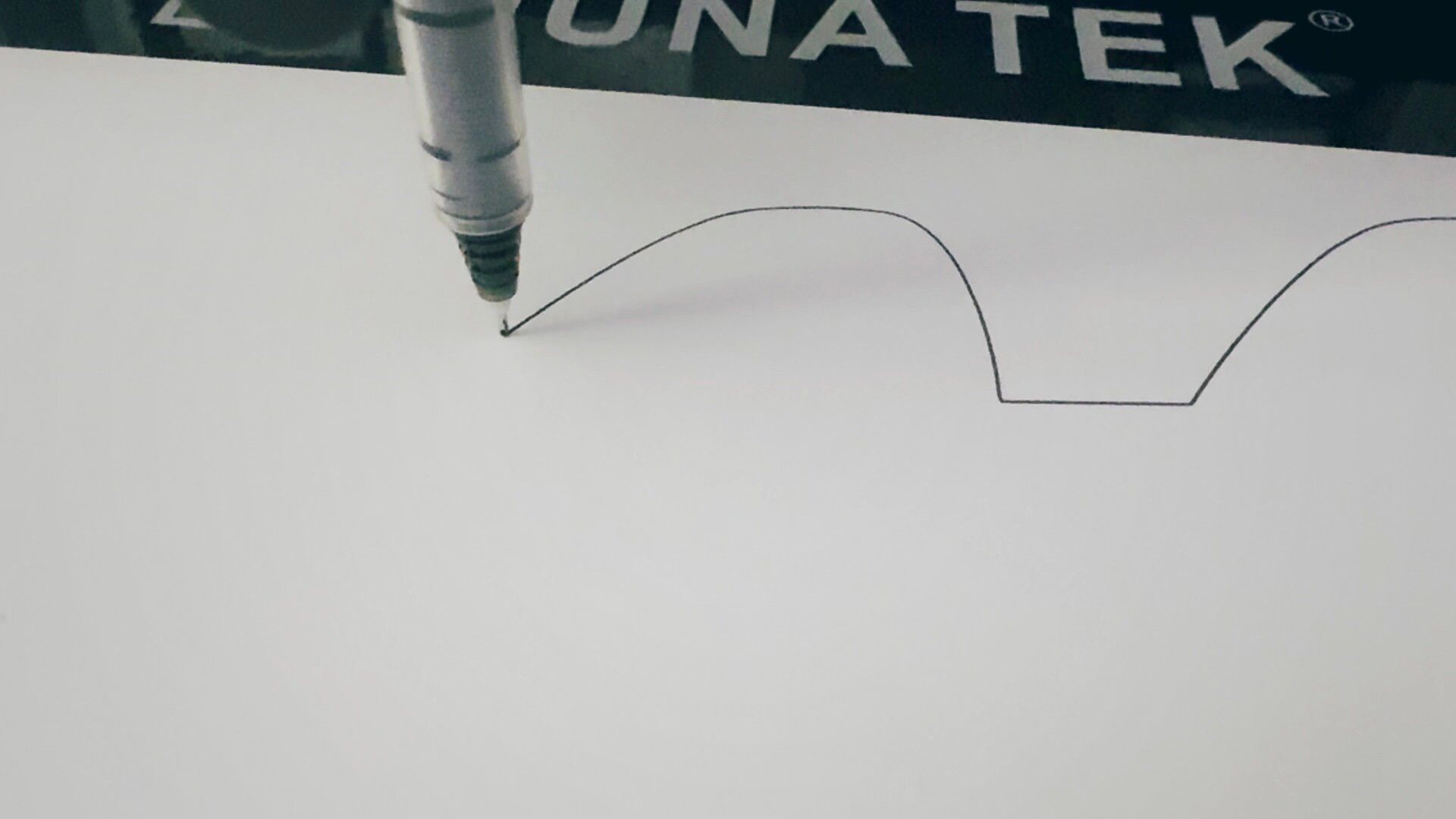 Thrilling! A pen plotter making a line on paper
